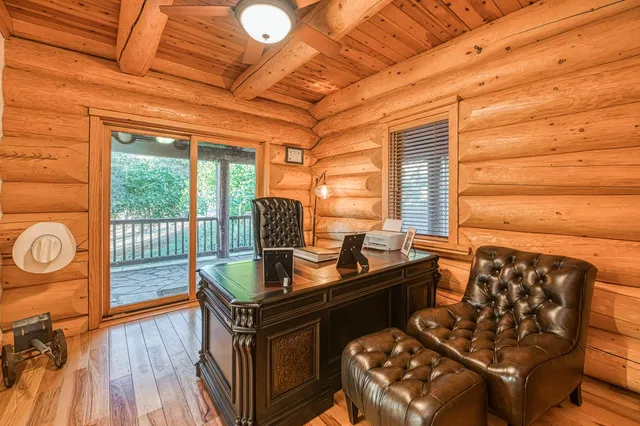 a bathroom with a granite countertop sink and a large mirror