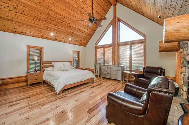 a backyard of a house with barbeque oven table and chairs