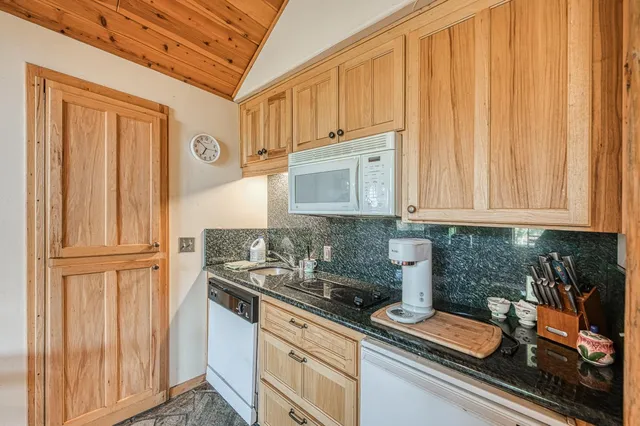 an aerial view of house with yard