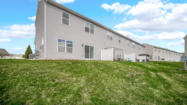 a view of a house with backyard
