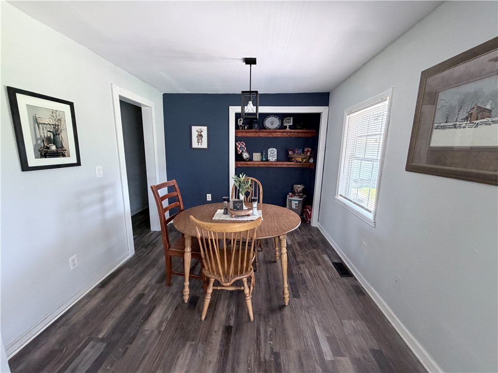 6800 Farmington Road Miamisburg, OH 45342 - Photo 10 of 32 This inviting dining area features durable flooring and a charming built-in for added appeal.