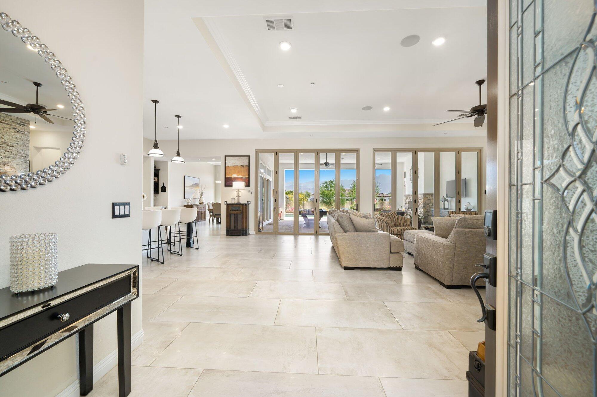 81675 Macbeth Street La Quinta, CA 92253 - Photo 13 of 76 a living room with furniture and a large window