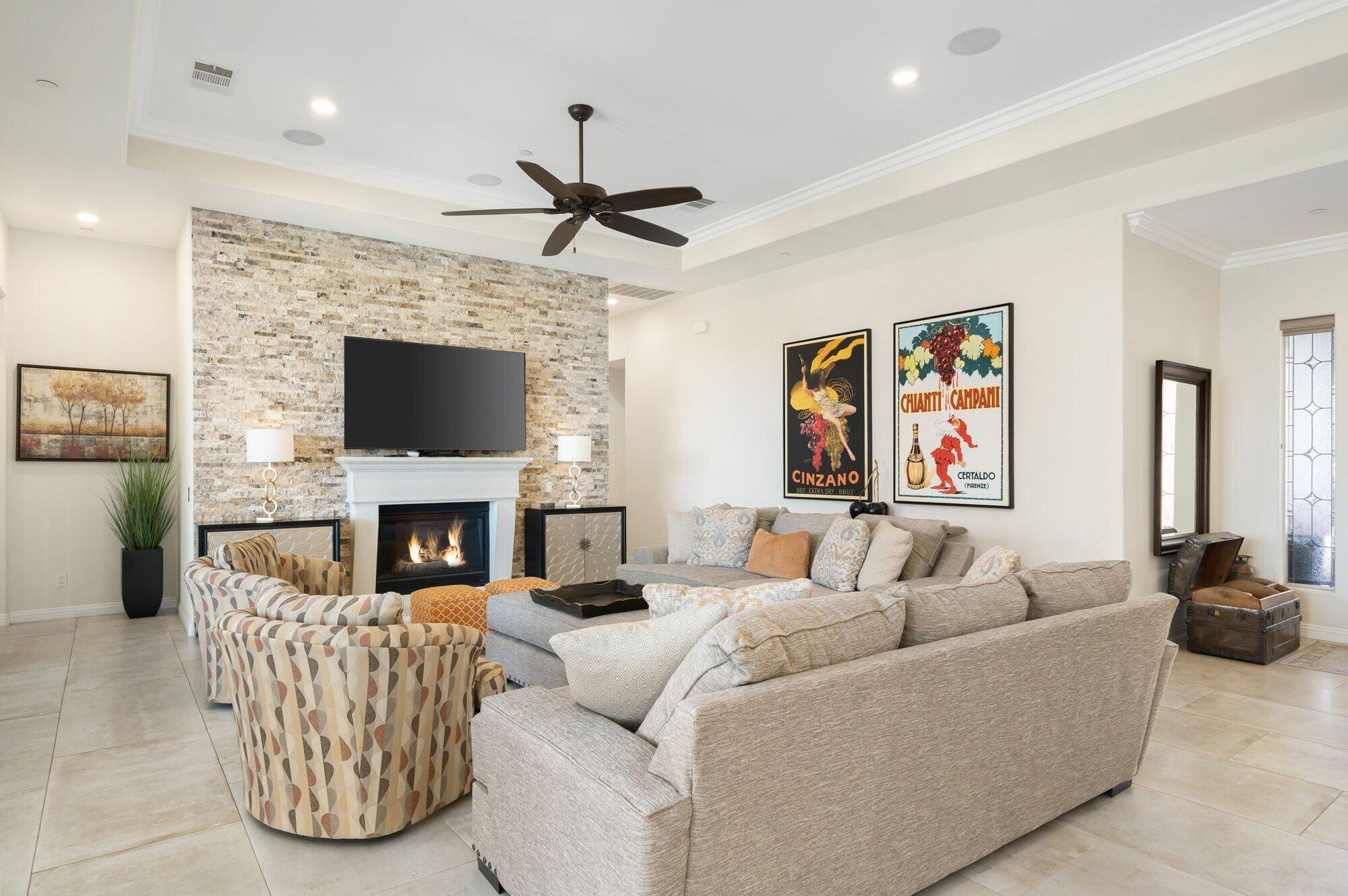 81675 Macbeth Street La Quinta, CA 92253 - Photo 17 of 76 a living room with furniture and a fireplace