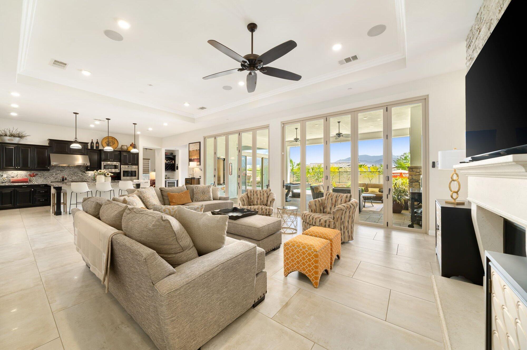 81675 Macbeth Street La Quinta, CA 92253 - Photo 20 of 76 a living room with furniture fireplace and a flat screen tv