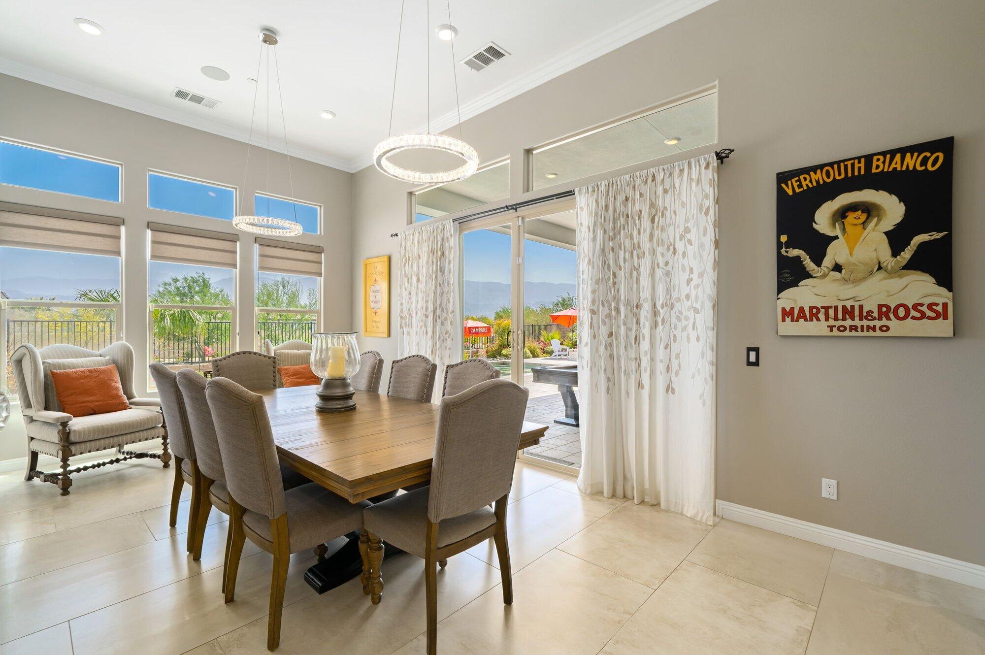 81675 Macbeth Street La Quinta, CA 92253 - Photo 28 of 76 a view of a dining room with furniture window and outside view