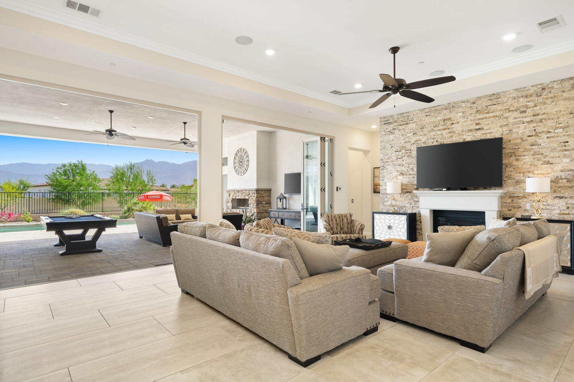 81675 Macbeth Street La Quinta, CA 92253 - Photo 29 of 76 a living room with furniture and a flat screen tv