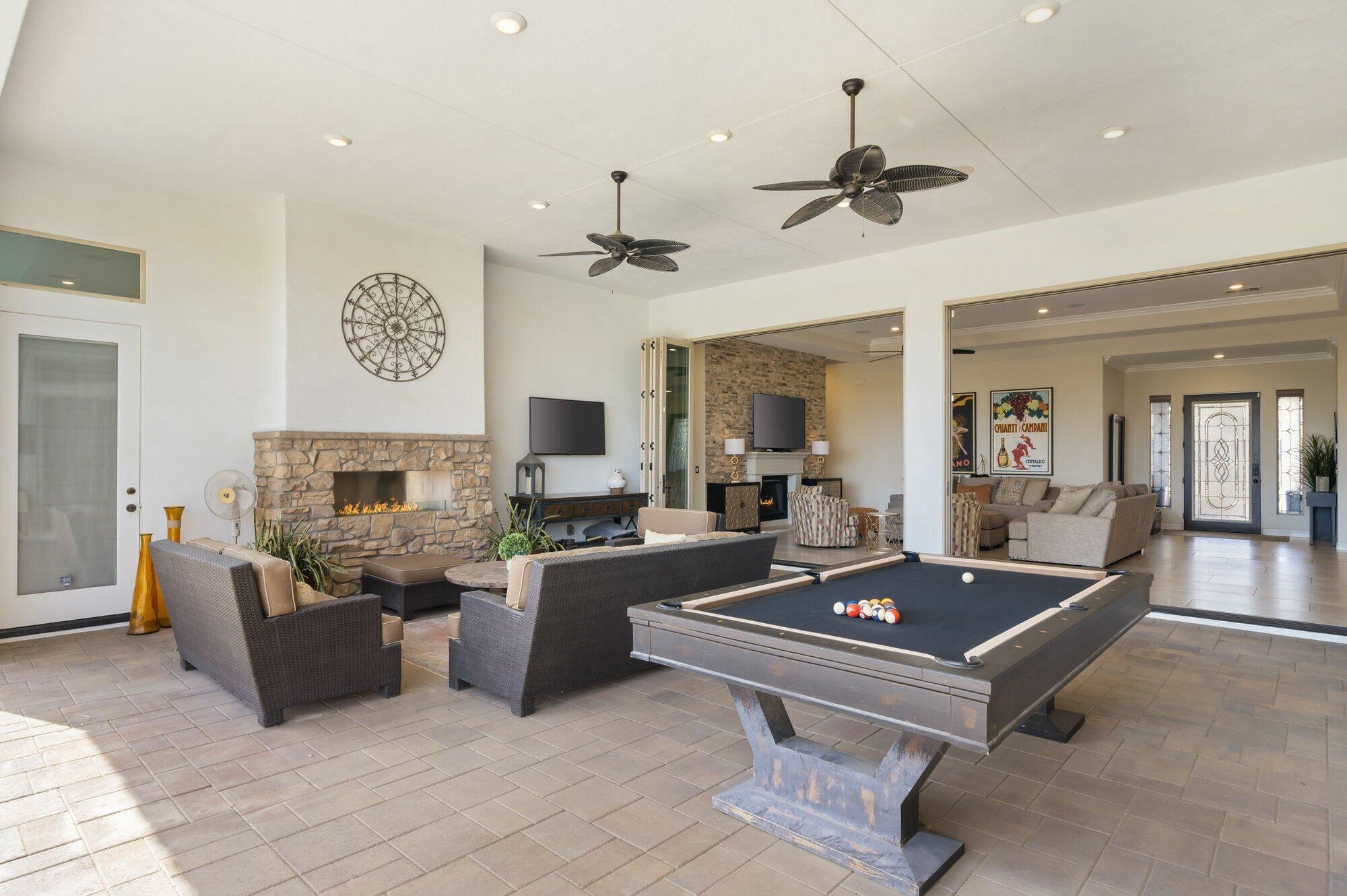 81675 Macbeth Street La Quinta, CA 92253 - Photo 34 of 76 a living room with furniture and a flat screen tv