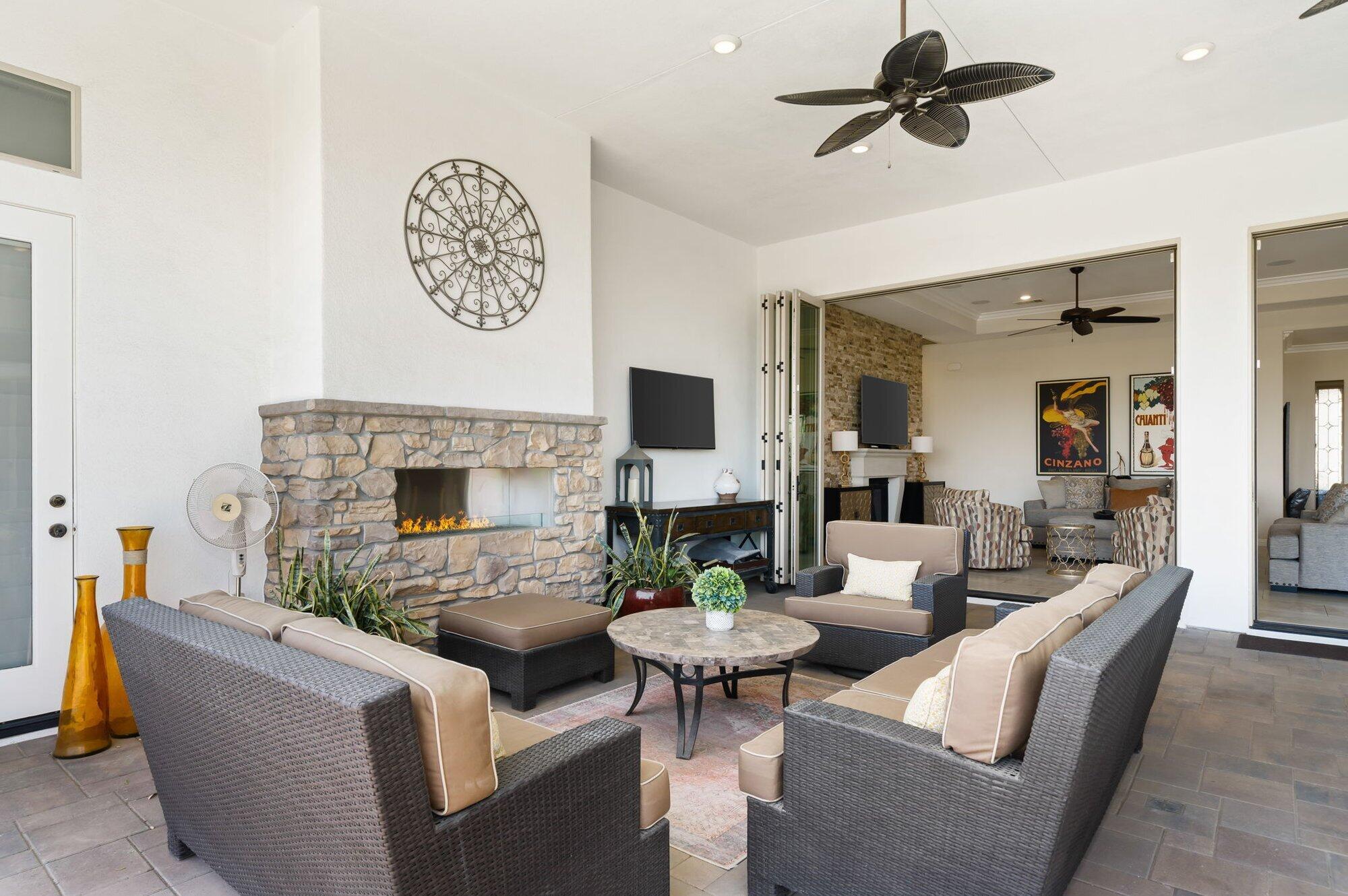 81675 Macbeth Street La Quinta, CA 92253 - Photo 35 of 76 a living room with furniture a fireplace and a flat screen tv