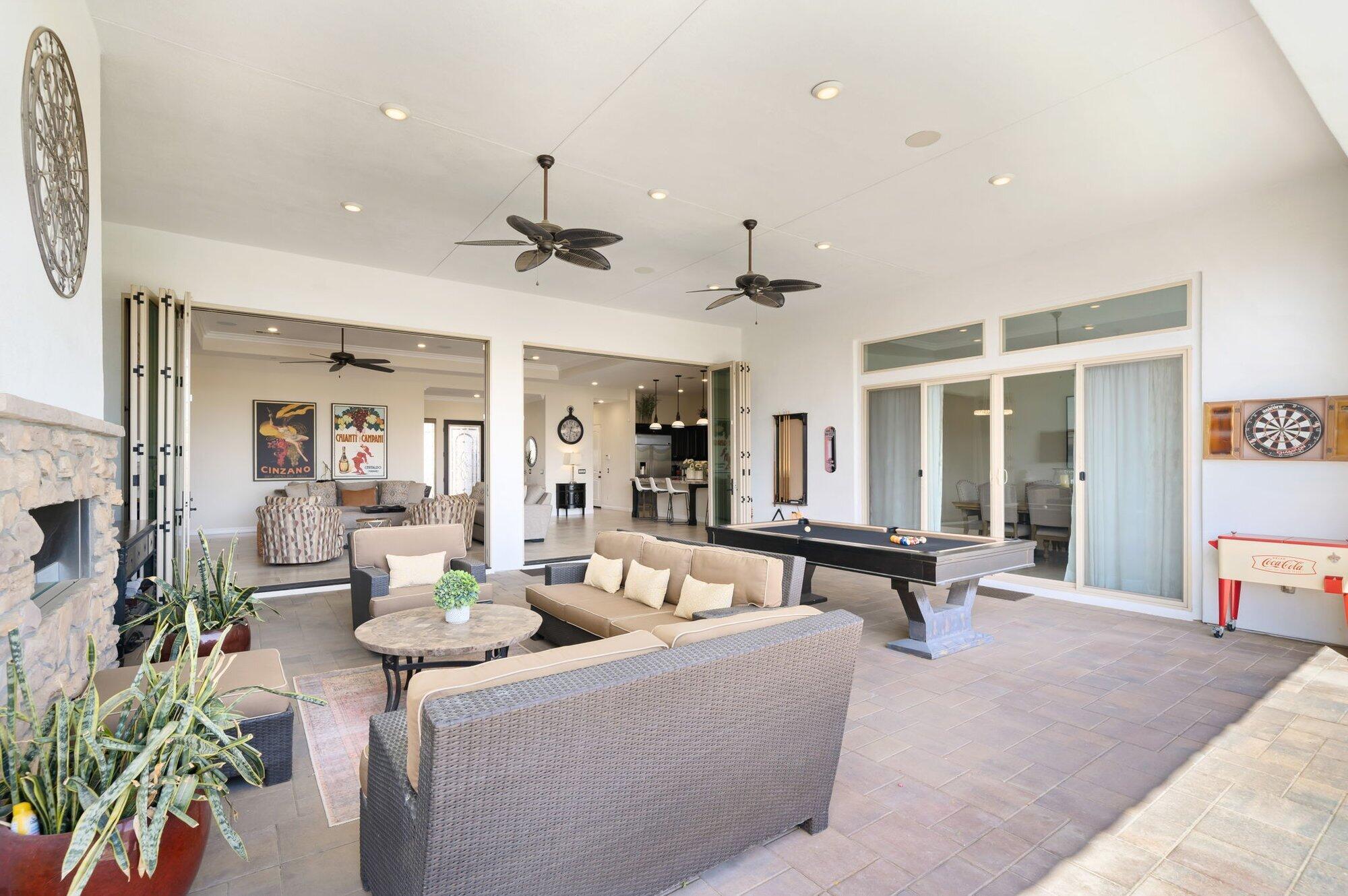 81675 Macbeth Street La Quinta, CA 92253 - Photo 36 of 76 a living room with furniture and a large window