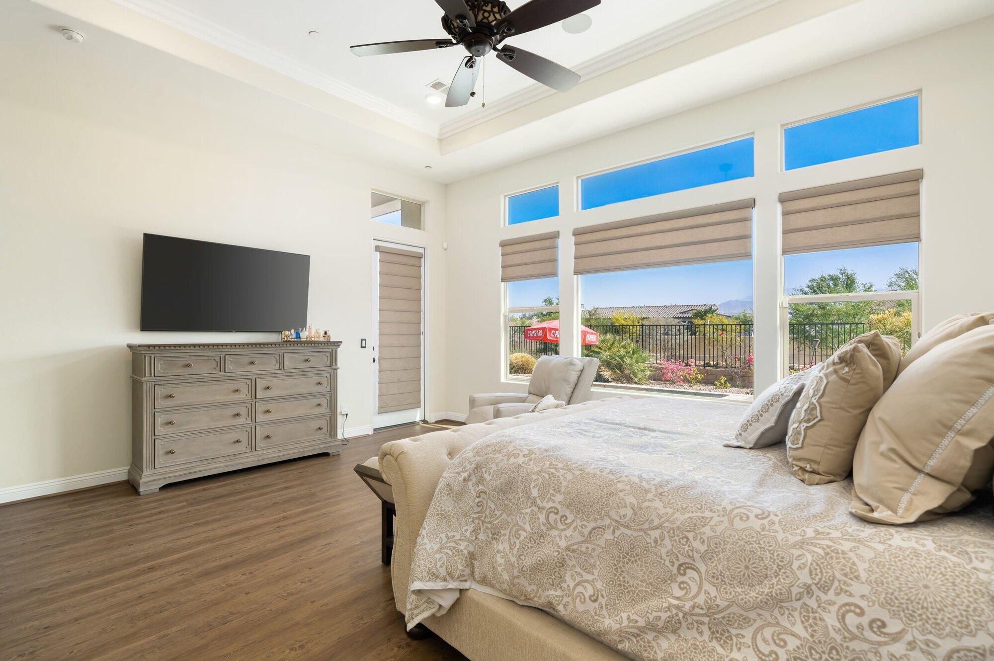 81675 Macbeth Street La Quinta, CA 92253 - Photo 38 of 76 a bed room with a bed television and a window