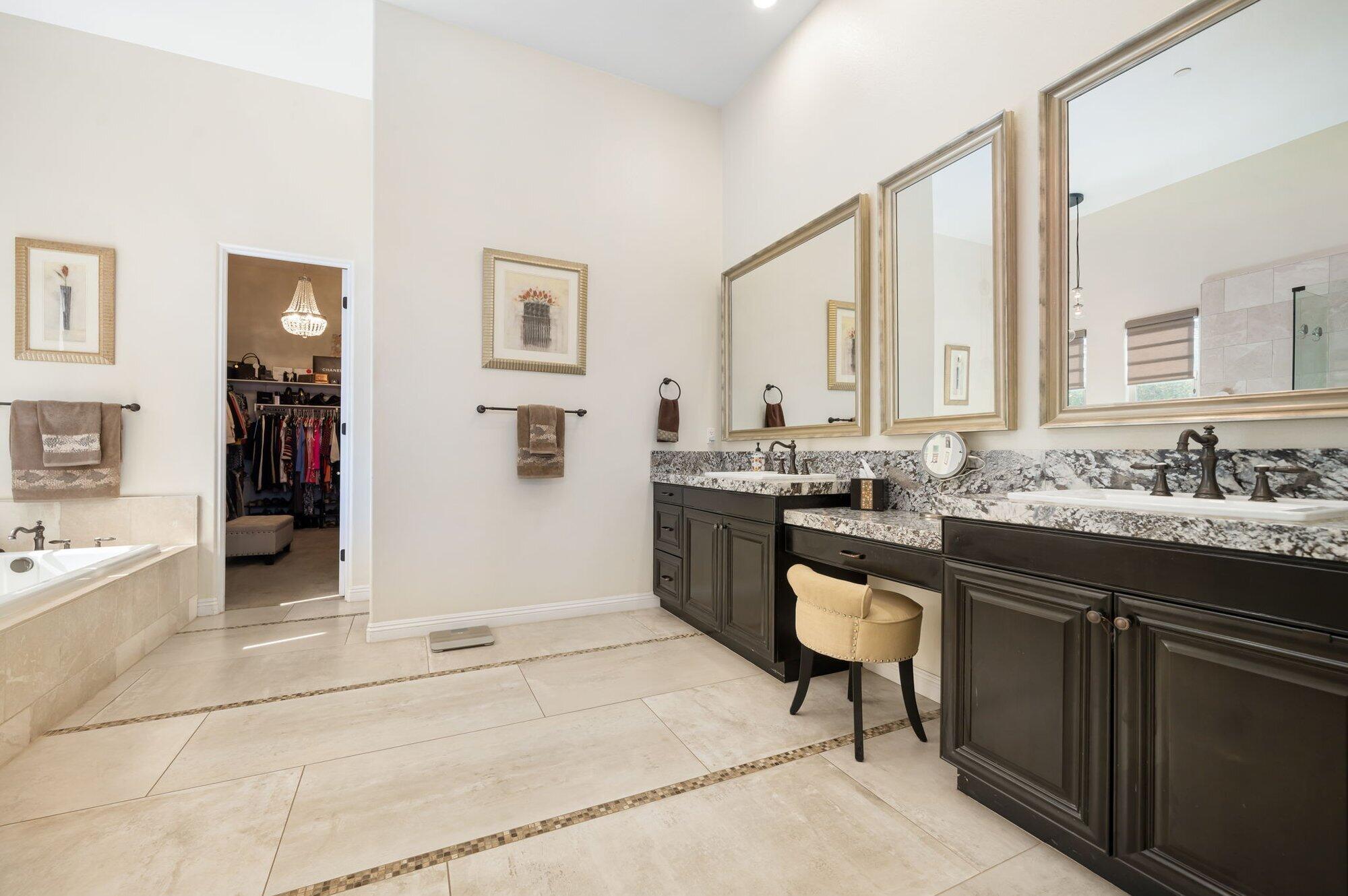 81675 Macbeth Street La Quinta, CA 92253 - Photo 39 of 76 a spacious bathroom with a sink double vanity and a mirror