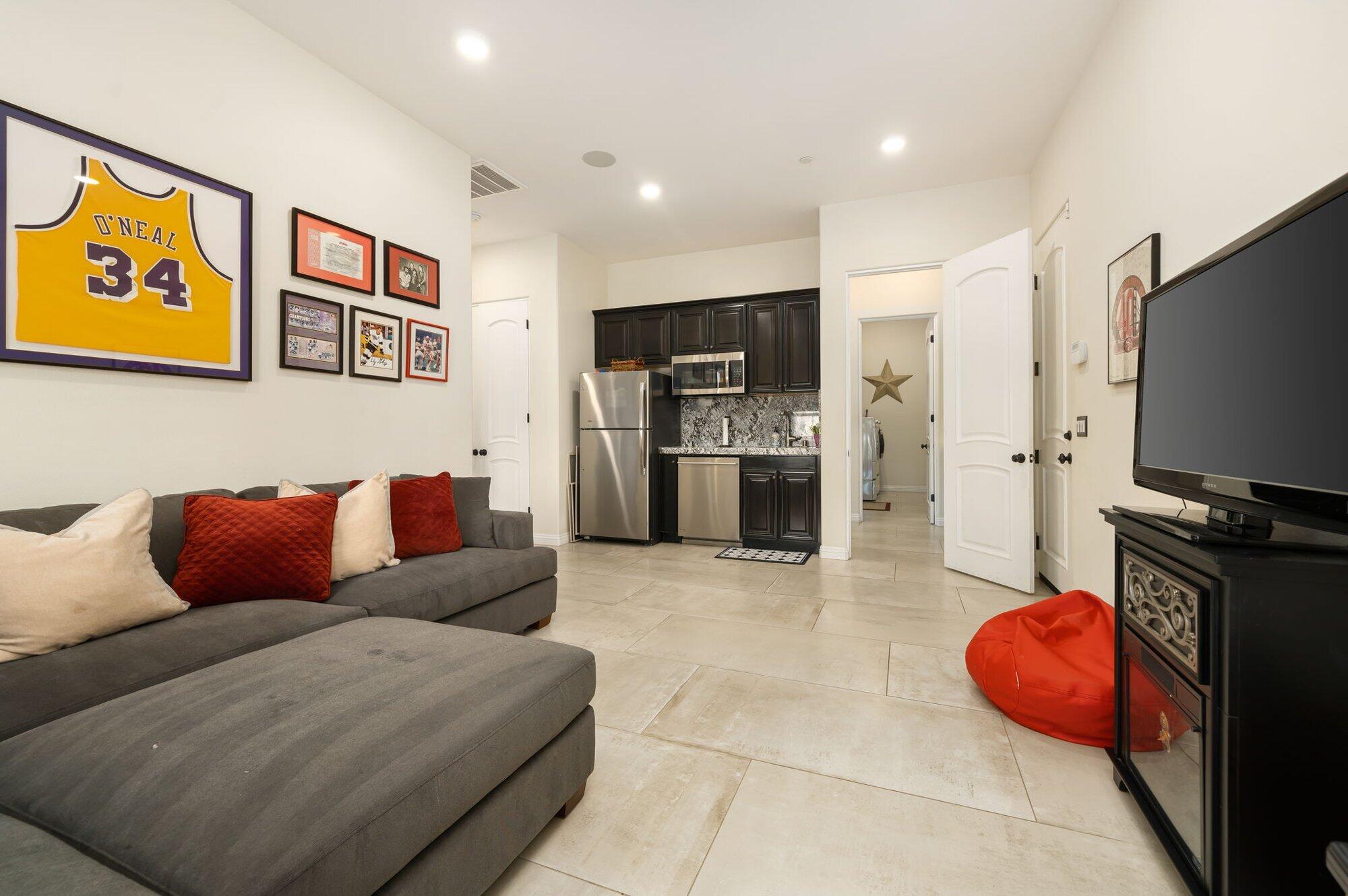 81675 Macbeth Street La Quinta, CA 92253 - Photo 43 of 76 a living room with furniture and a flat screen tv