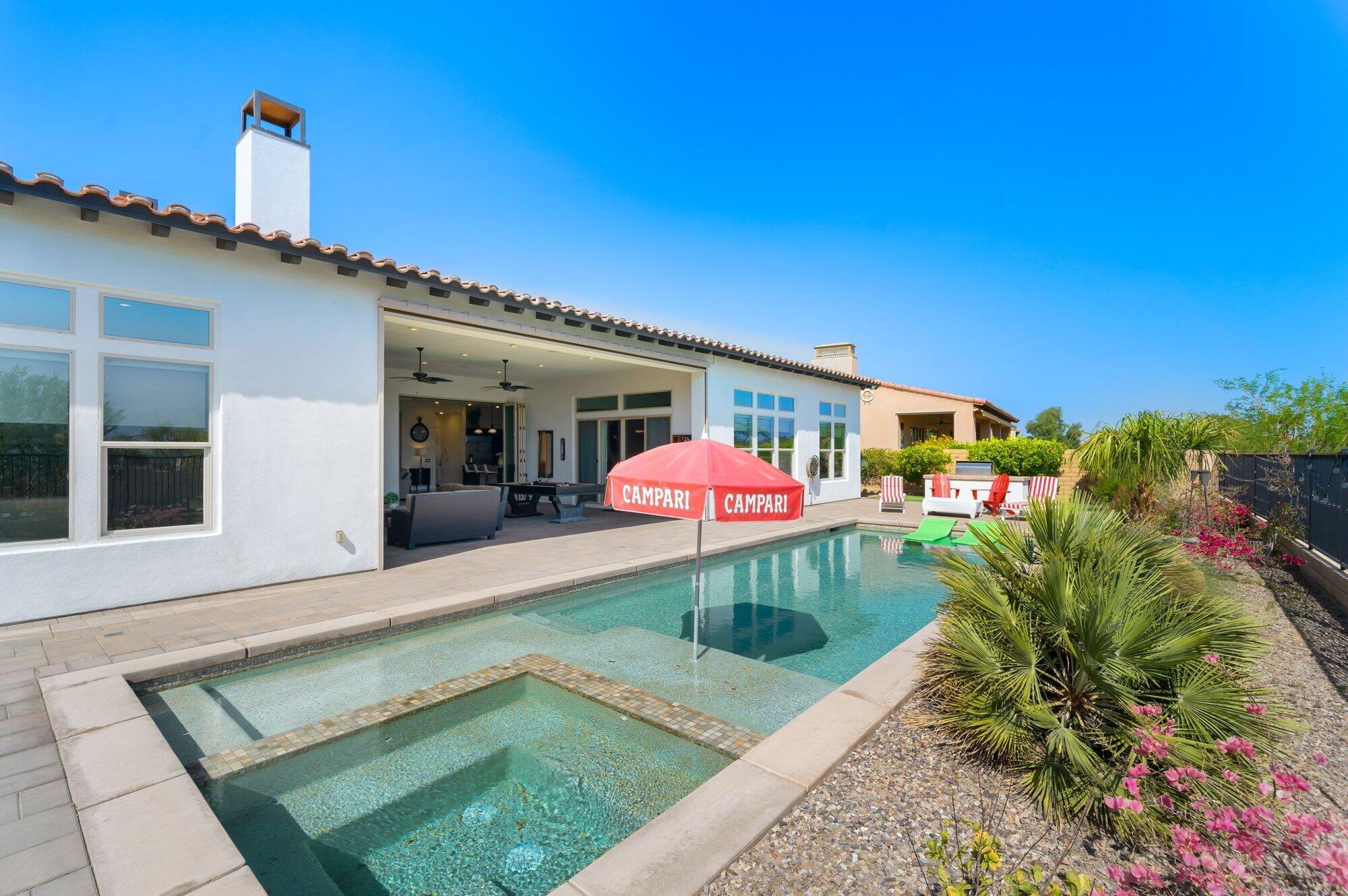 81675 Macbeth Street La Quinta, CA 92253 - Photo 57 of 76 a view of a house with a yard porch and furniture