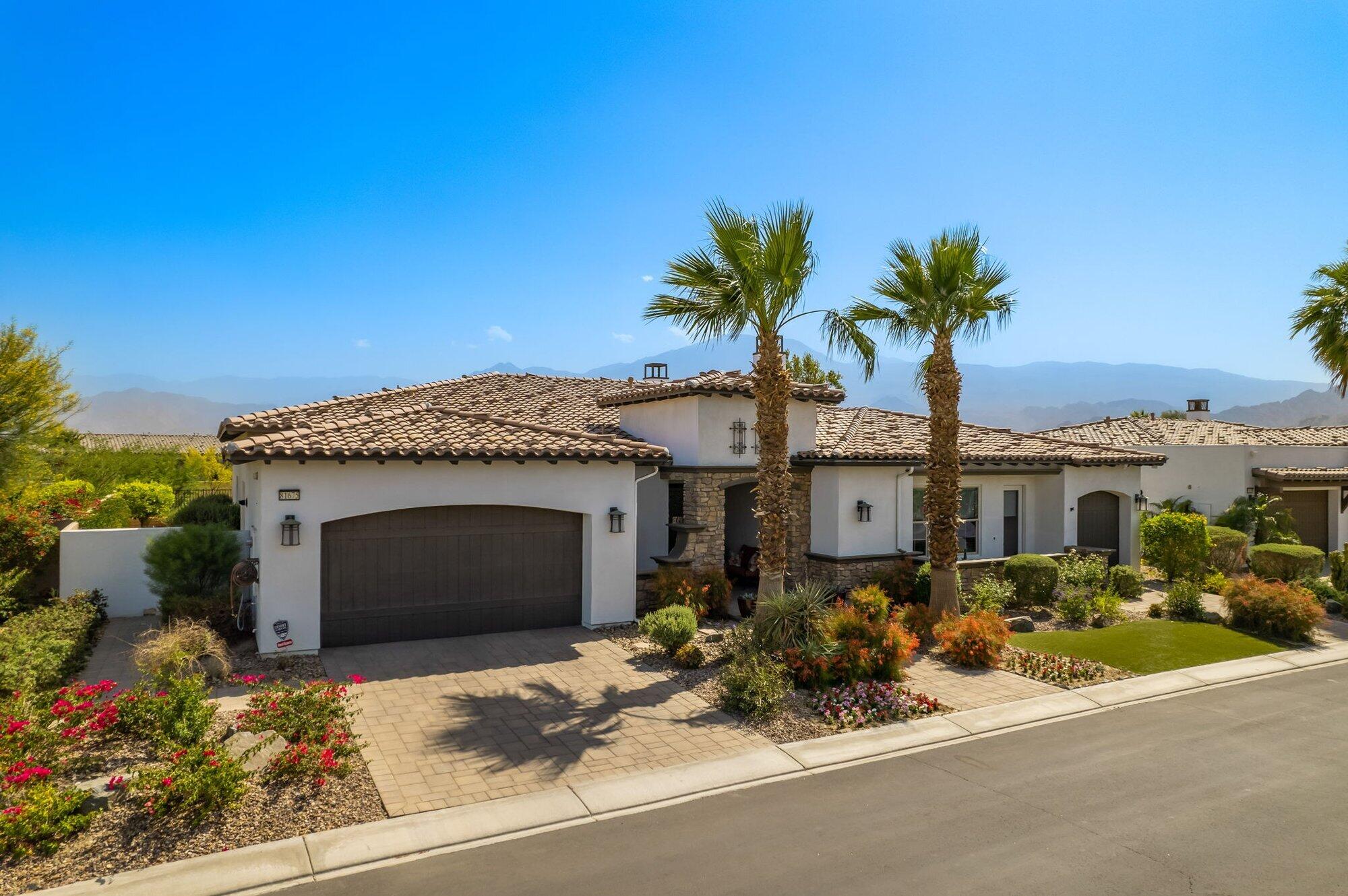 81675 Macbeth Street La Quinta, CA 92253 - Photo 58 of 76 front view of a house with a potted plant
