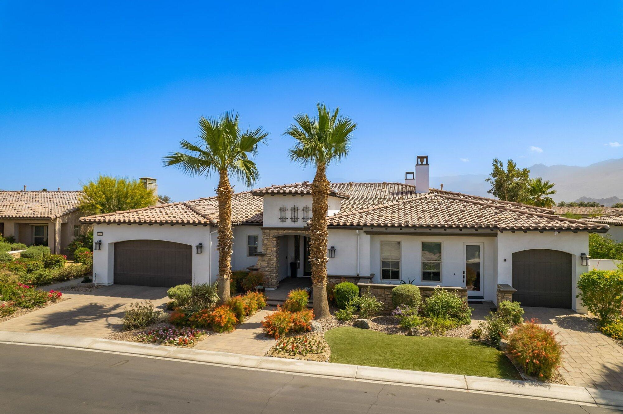 81675 Macbeth Street La Quinta, CA 92253 - Photo 59 of 76 a front view of a house with a yard and garage