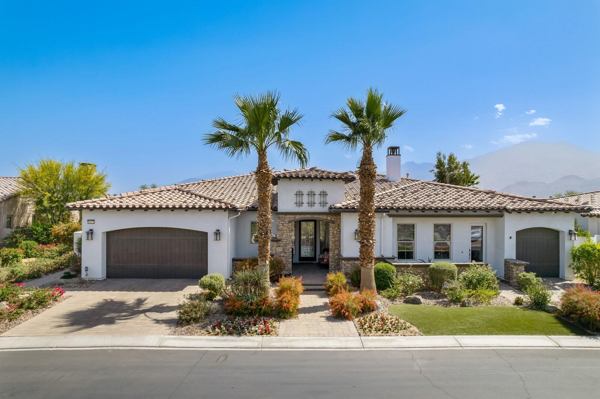 81675 Macbeth Street La Quinta, CA 92253 - Photo 60 of 76 a front view of a house with a garden