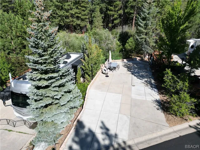 a pathway of a house with a yard