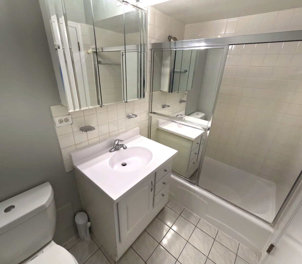 6325 North Sheridan Road, Unit 2003 Chicago, IL 60660 - Photo 6 of 17 a bathroom with a sink toilet and shower