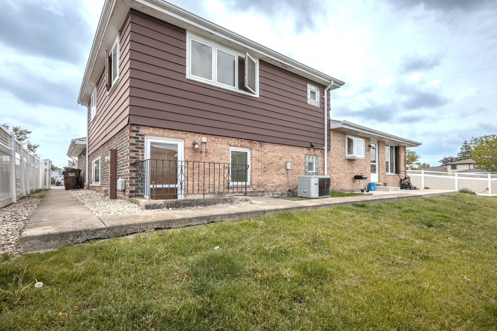 8440 Anvil Place Tinley Park, IL 60487 - Photo 18 of 18 a front view of a house with a yard and porch