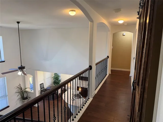 an empty room with a empty space and a ceiling fan