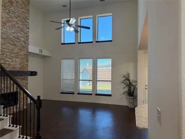 a view of an entryway with wooden floor
