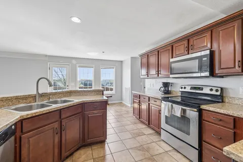 a kitchen with a sink and a window