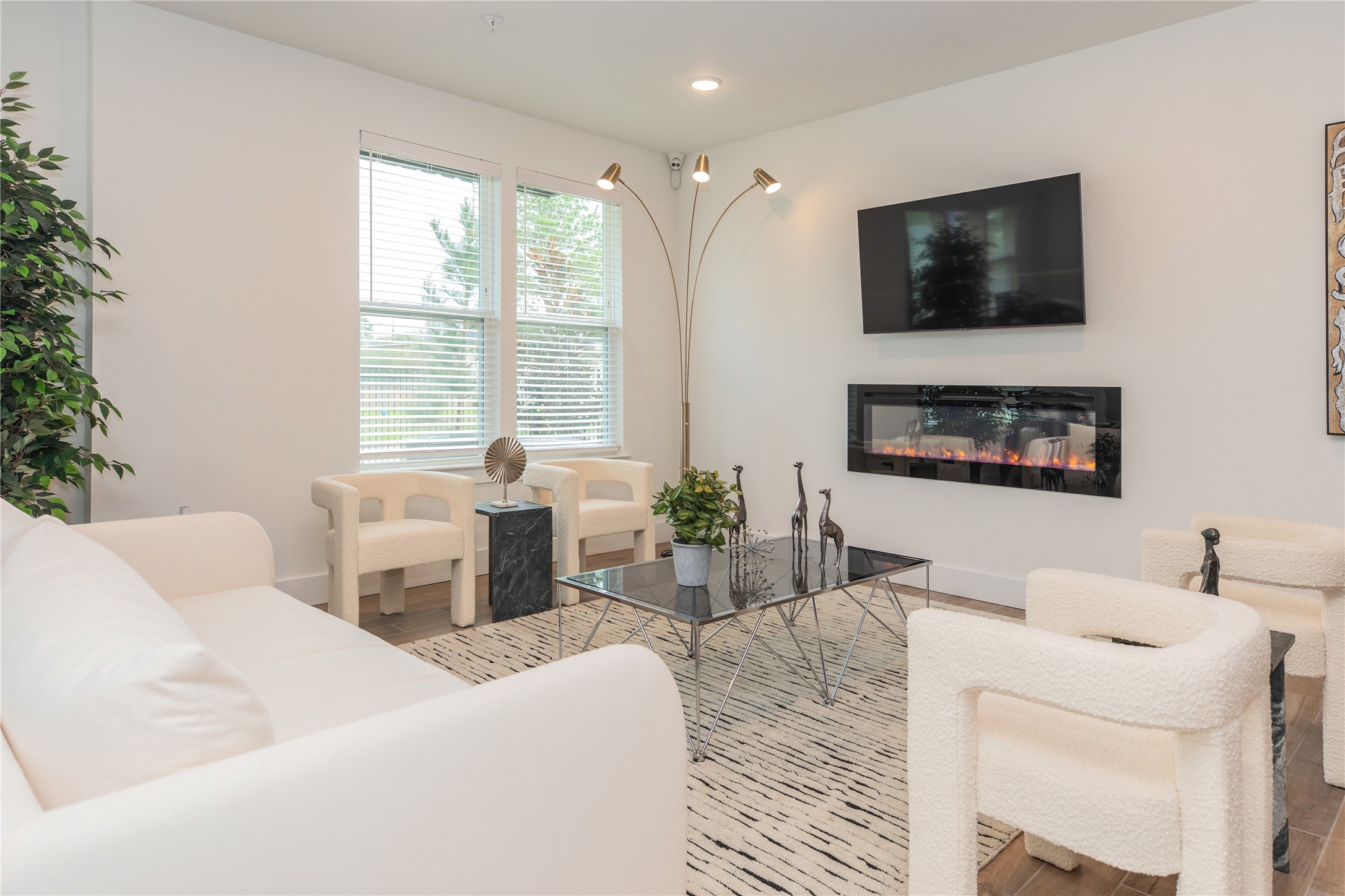 14809 Ralston Road, Unit A18302 Humble, TX 77396 - Photo 5 of 16 a living room with furniture and a flat screen tv