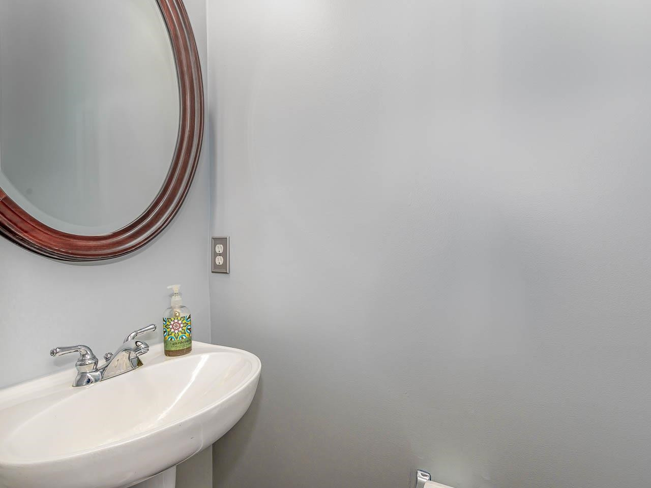 3702 Appling Way Durham, NC 27703 - Photo 11 of 34 a bathroom with a sink and a mirror