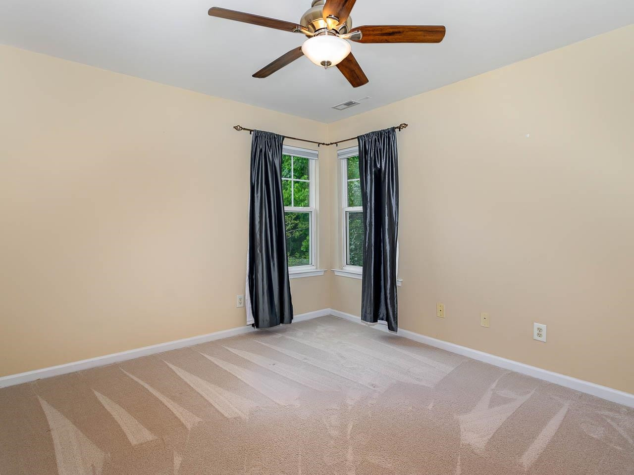 3702 Appling Way Durham, NC 27703 - Photo 20 of 34 a view of a room with a ceiling fan and a window