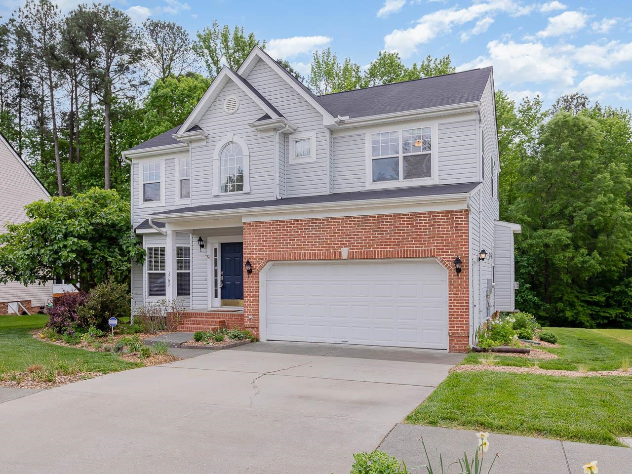 3702 Appling Way Durham, NC 27703 - Photo 2 of 34 front view of house with a yard