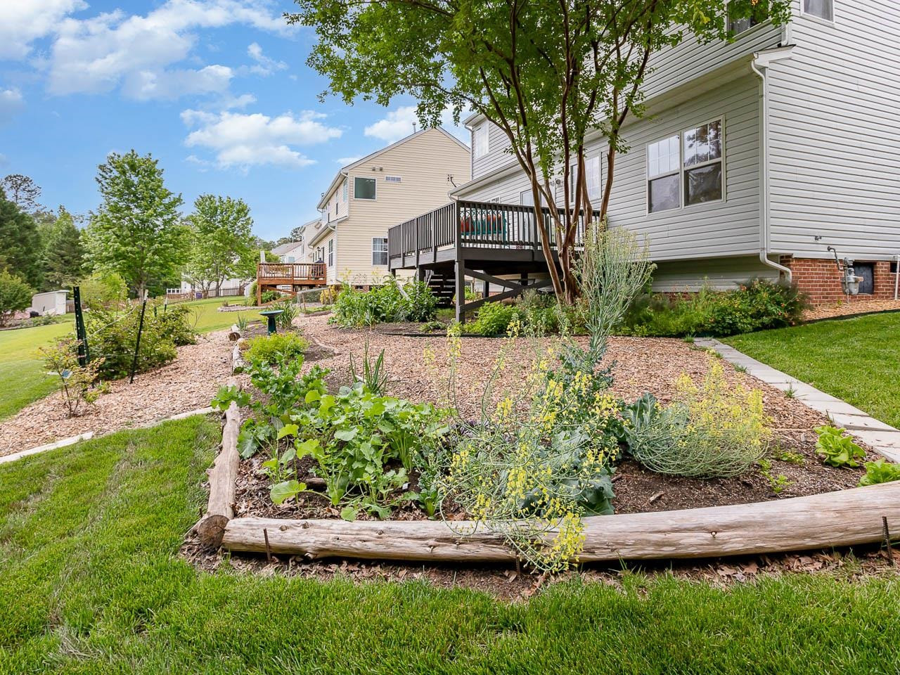 3702 Appling Way Durham, NC 27703 - Photo 29 of 34 a front view of a house with a yard garage and outdoor seating