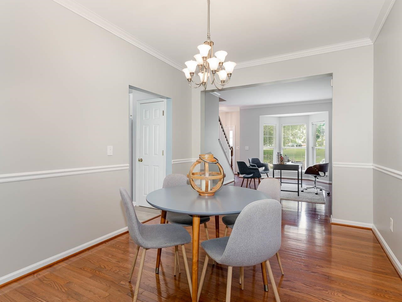 3702 Appling Way Durham, NC 27703 - Photo 10 of 34 a view of a dining room with furniture wooden floor and chandelier
