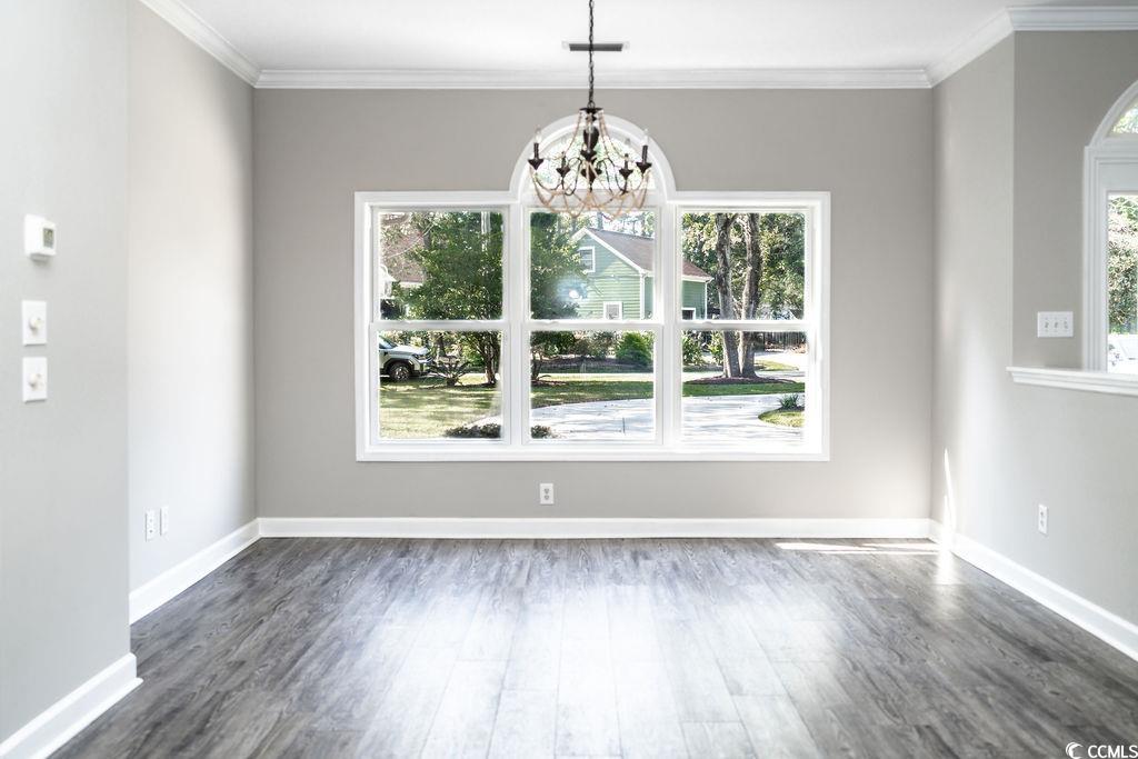 4346 Goude Street Murrells Inlet, SC 29576 - Photo 6 of 34 Unfurnished dining area with dark wood-type floori