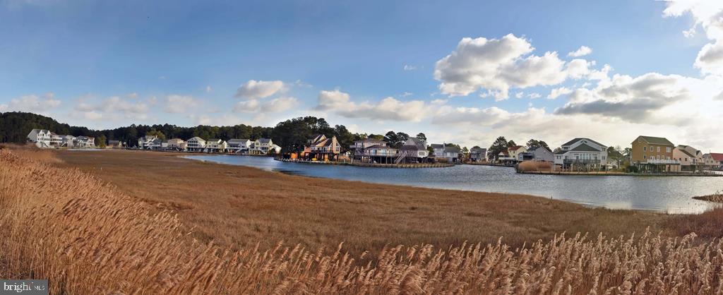 Lot 1361 Blackbeard Road Greenbackville, VA 23356 - Photo 15 of 27 a view of a lake with houses in the back