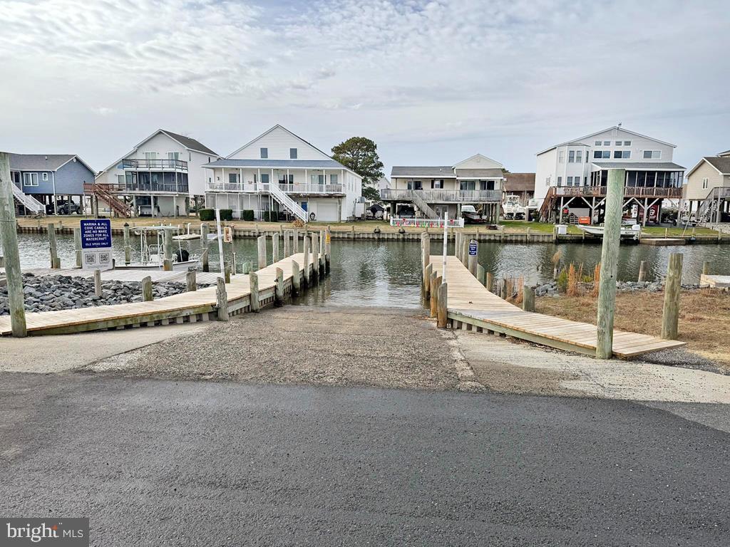 Lot 1361 Blackbeard Road Greenbackville, VA 23356 - Photo 16 of 27 a view of a lake with a city