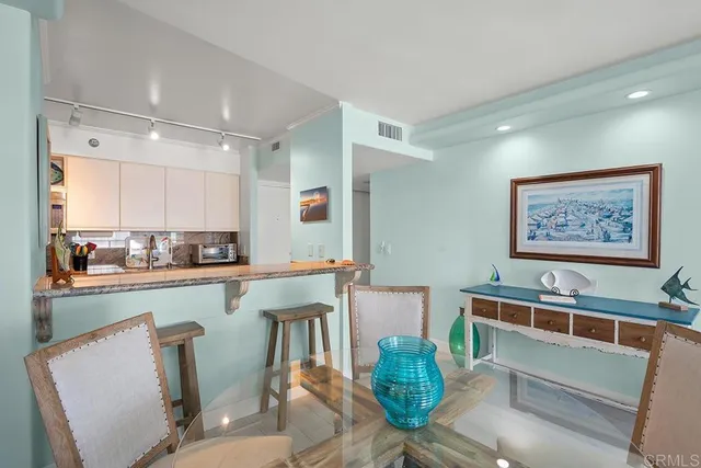 a view of living room filled with furniture and window