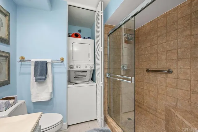 a bedroom with furniture and a flat screen tv