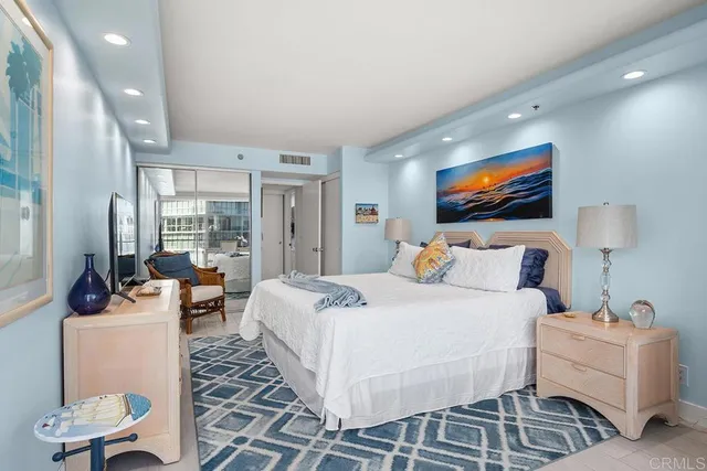 a balcony with table and chairs