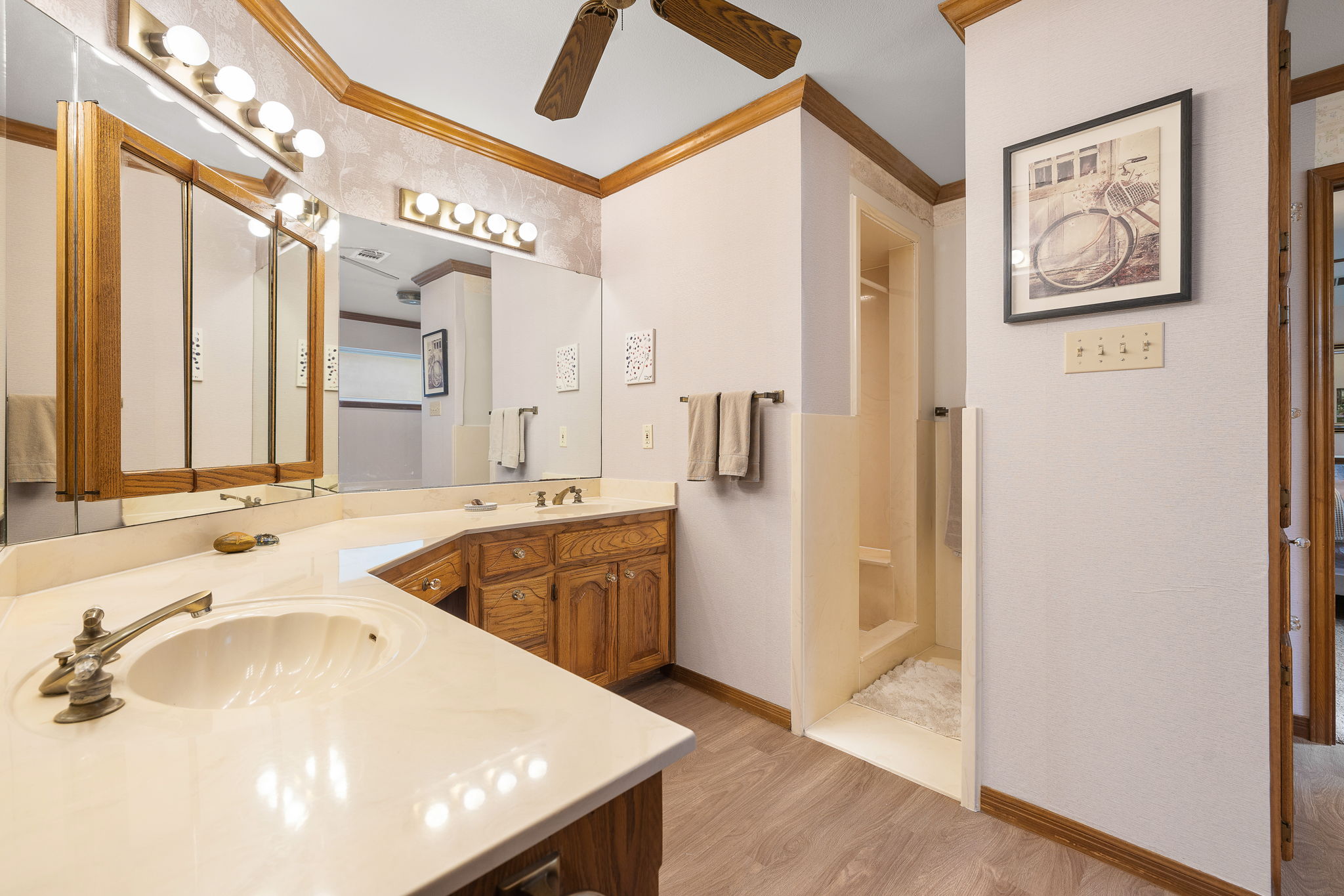 136 Valley View Road Georgetown, TX 78633 - Photo 22 of 40 So much space in this primary bathroom! The private entrance to the standalone shower is there in the background.