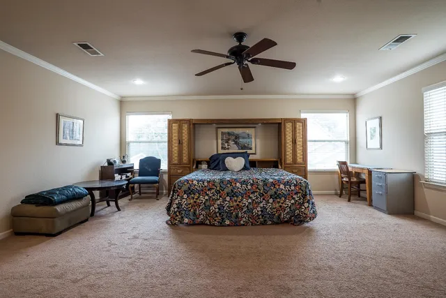 a bedroom with a bed and furniture