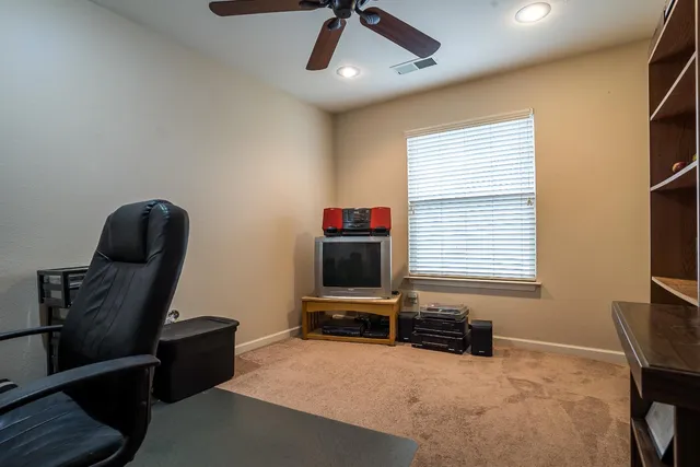 a livingroom with furniture and a flat screen tv