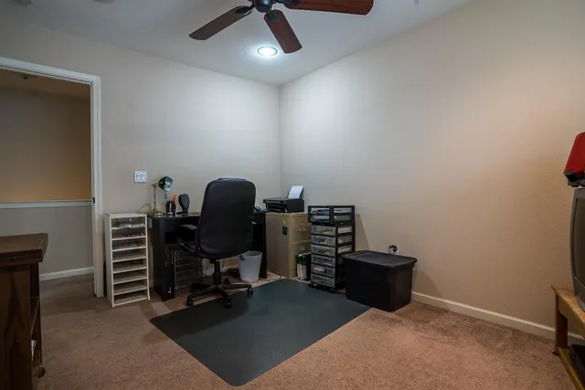 a view of a workspace with furniture