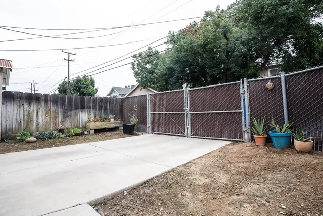 a view of a backyard with sitting area