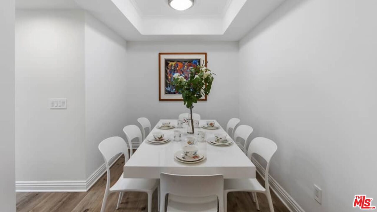 261 South Reeves Drive Beverly Hills, CA 90212 - Photo 13 of 43 a view of a dining room with furniture and wooden floor