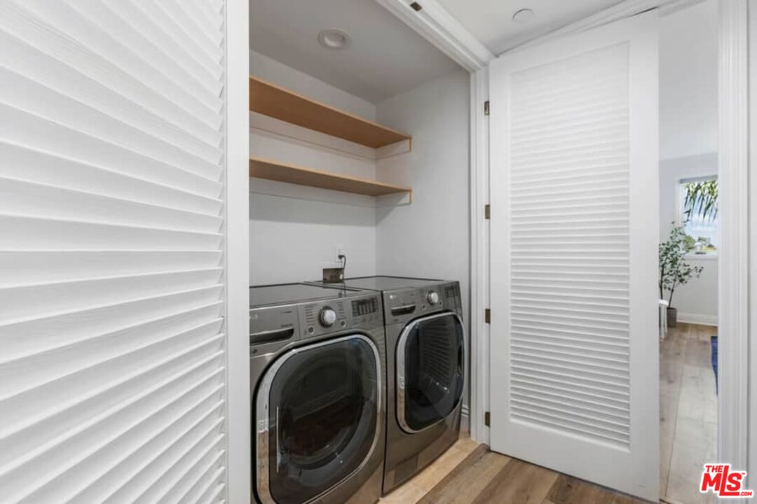 261 South Reeves Drive Beverly Hills, CA 90212 - Photo 16 of 43 a view of a hallway with washer and dryer