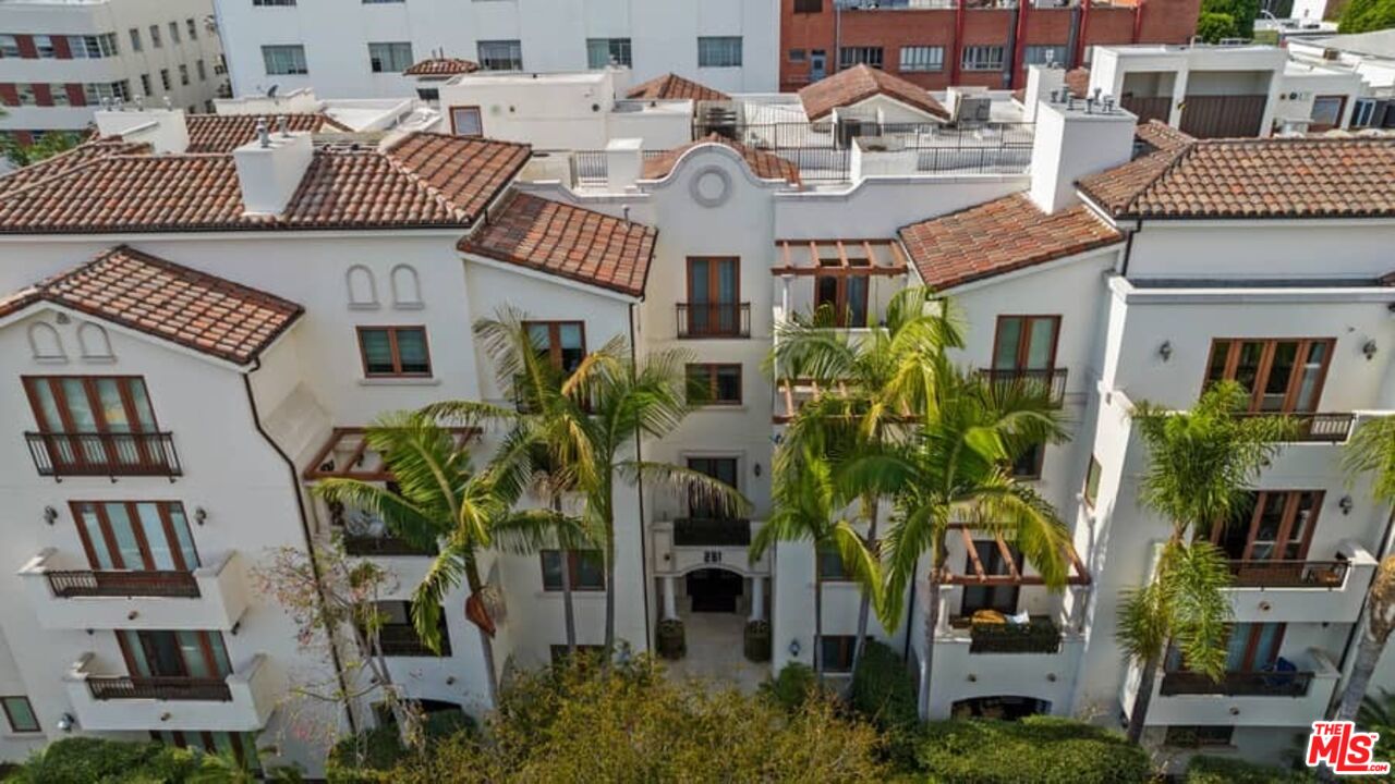 261 South Reeves Drive Beverly Hills, CA 90212 - Photo 2 of 43 a front view of a house with garden