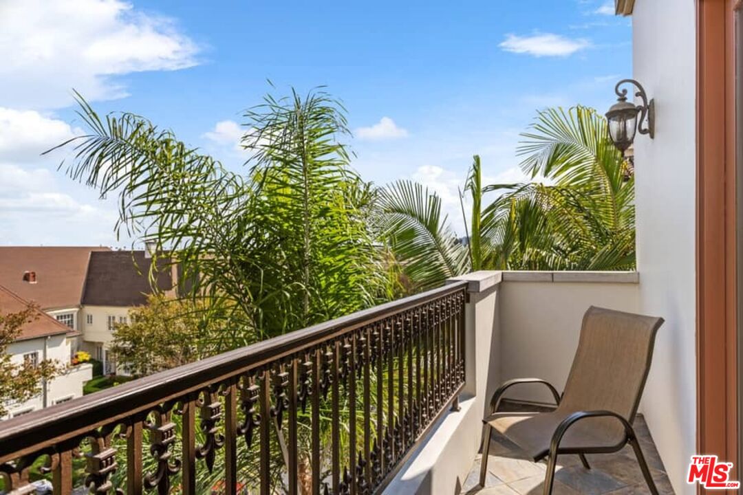 261 South Reeves Drive Beverly Hills, CA 90212 - Photo 31 of 43 a view of a balcony with chairs