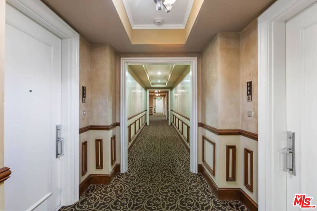 261 South Reeves Drive Beverly Hills, CA 90212 - Photo 33 of 43 a view of a hallway with a flower pot