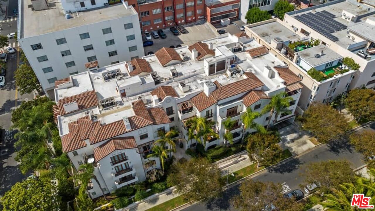 261 South Reeves Drive Beverly Hills, CA 90212 - Photo 40 of 43 a view of building with lot of plants