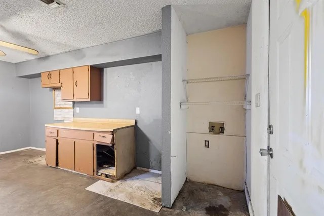 a bathroom with a sink dryer and washer